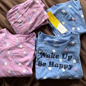 Carter’s girls pajamas.  Size 12. 100 percent cotton. Two pairs in one set.